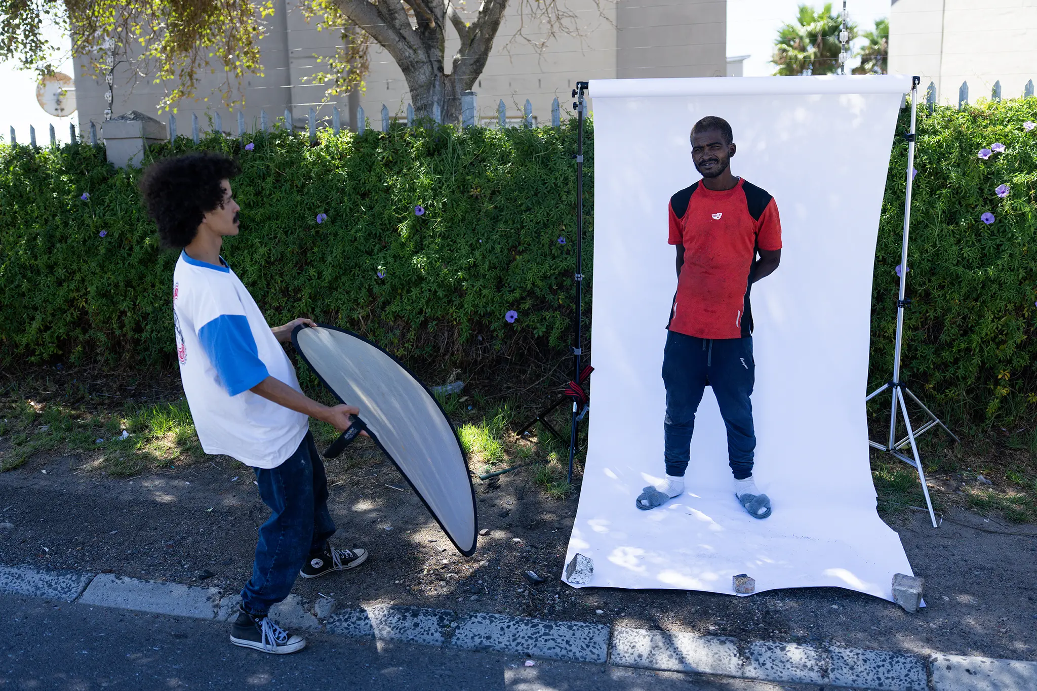 Behind-the-scenes: Avron Carlson being photographed in an outdoor portrait studio