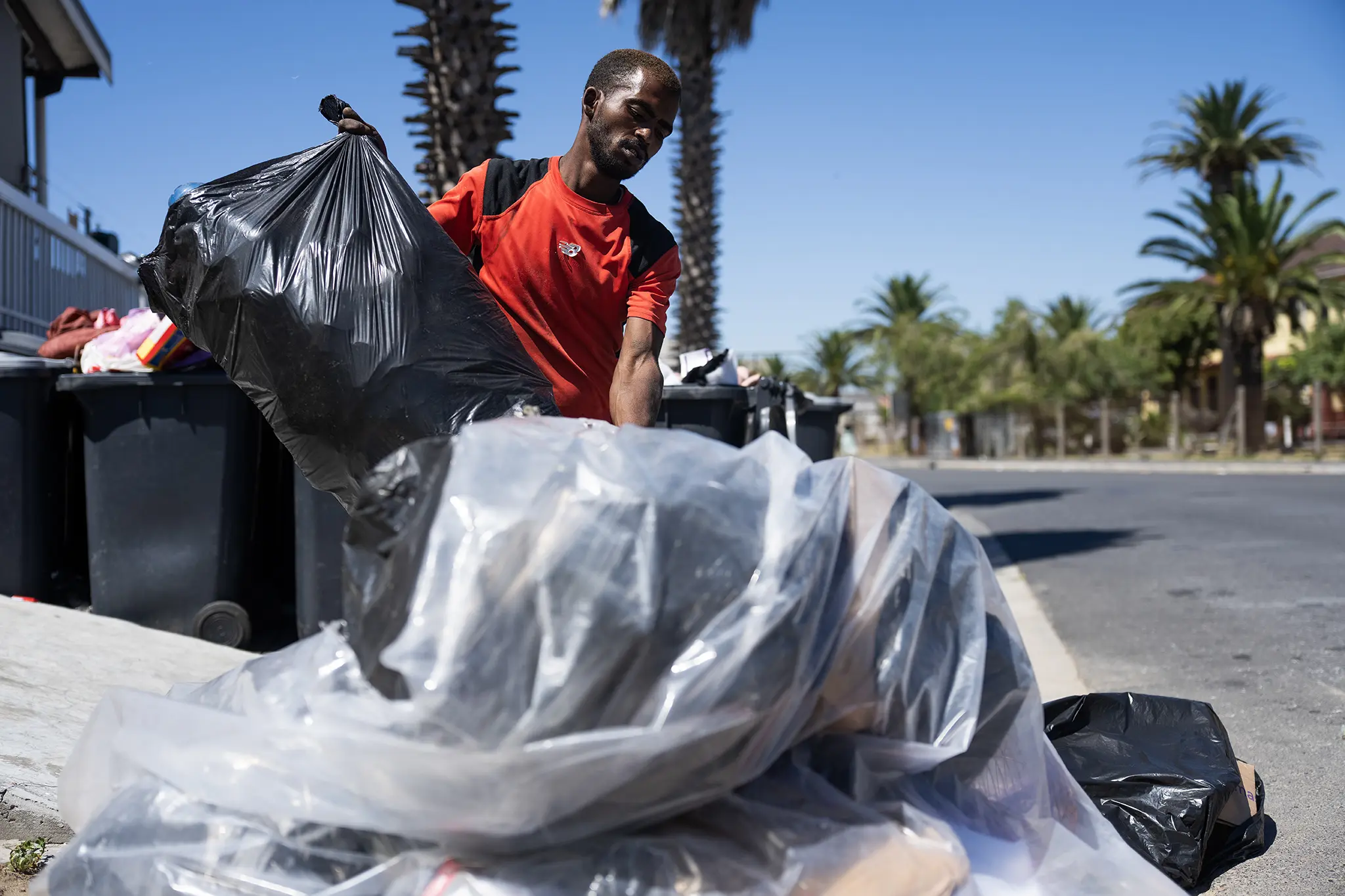 Avron Carlson gathers recycling material