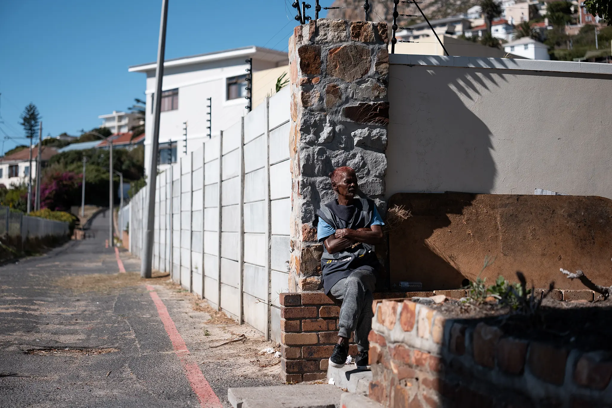 Claudine takes a break while working as a car guard.