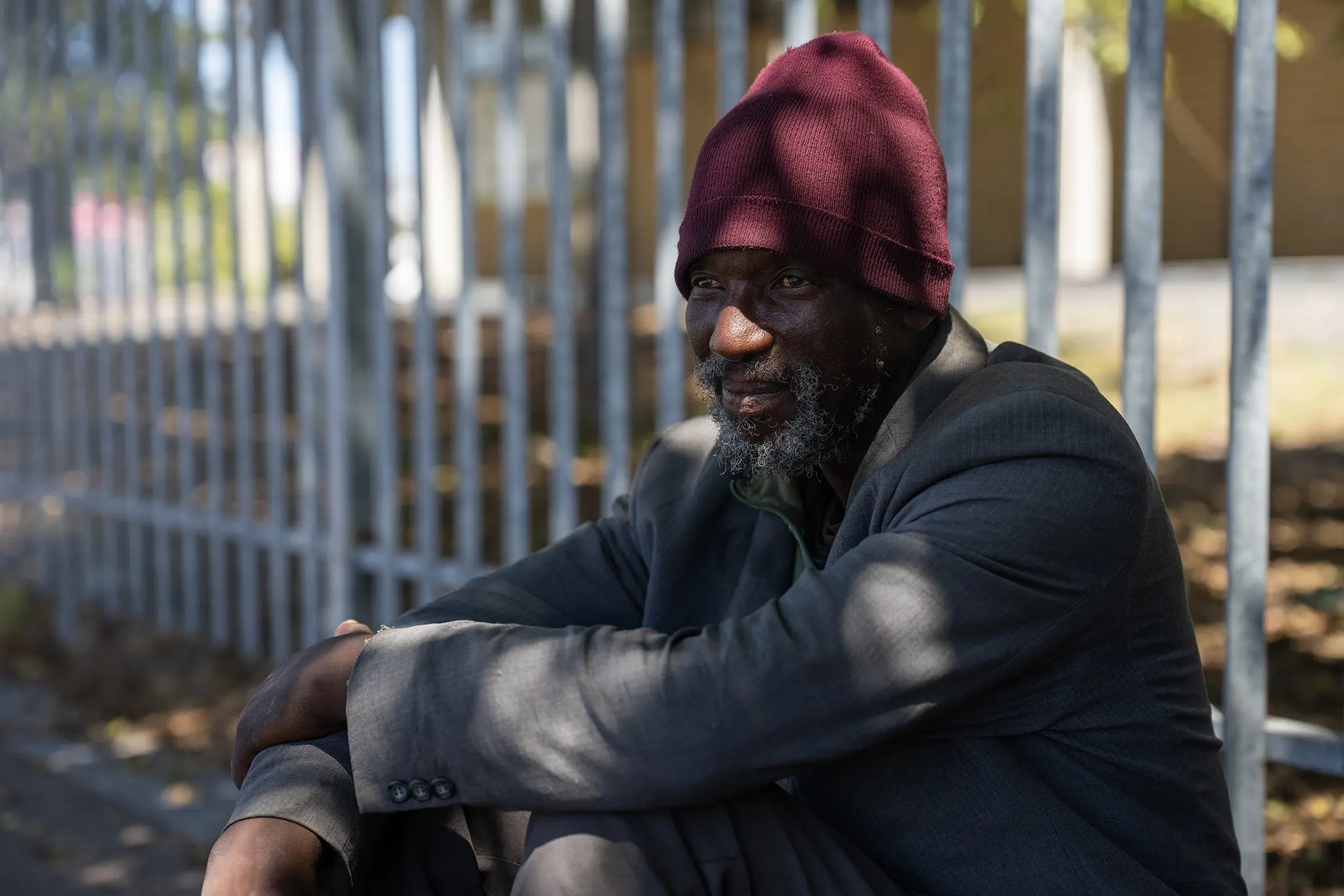 Charles Matika sitting