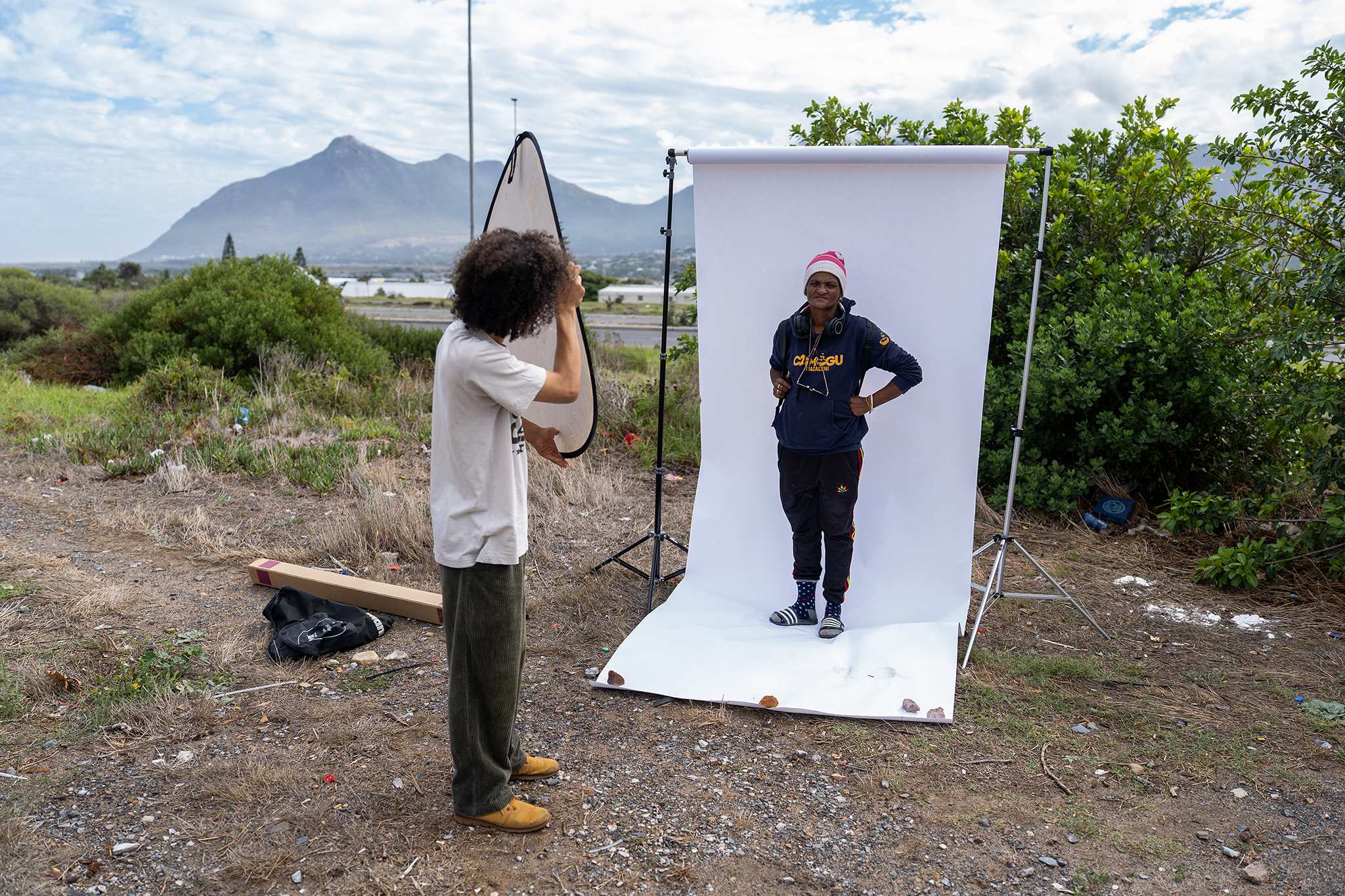 Behind-the-scenes: Chevon Roubain being photographed in an outdoor portrait studio