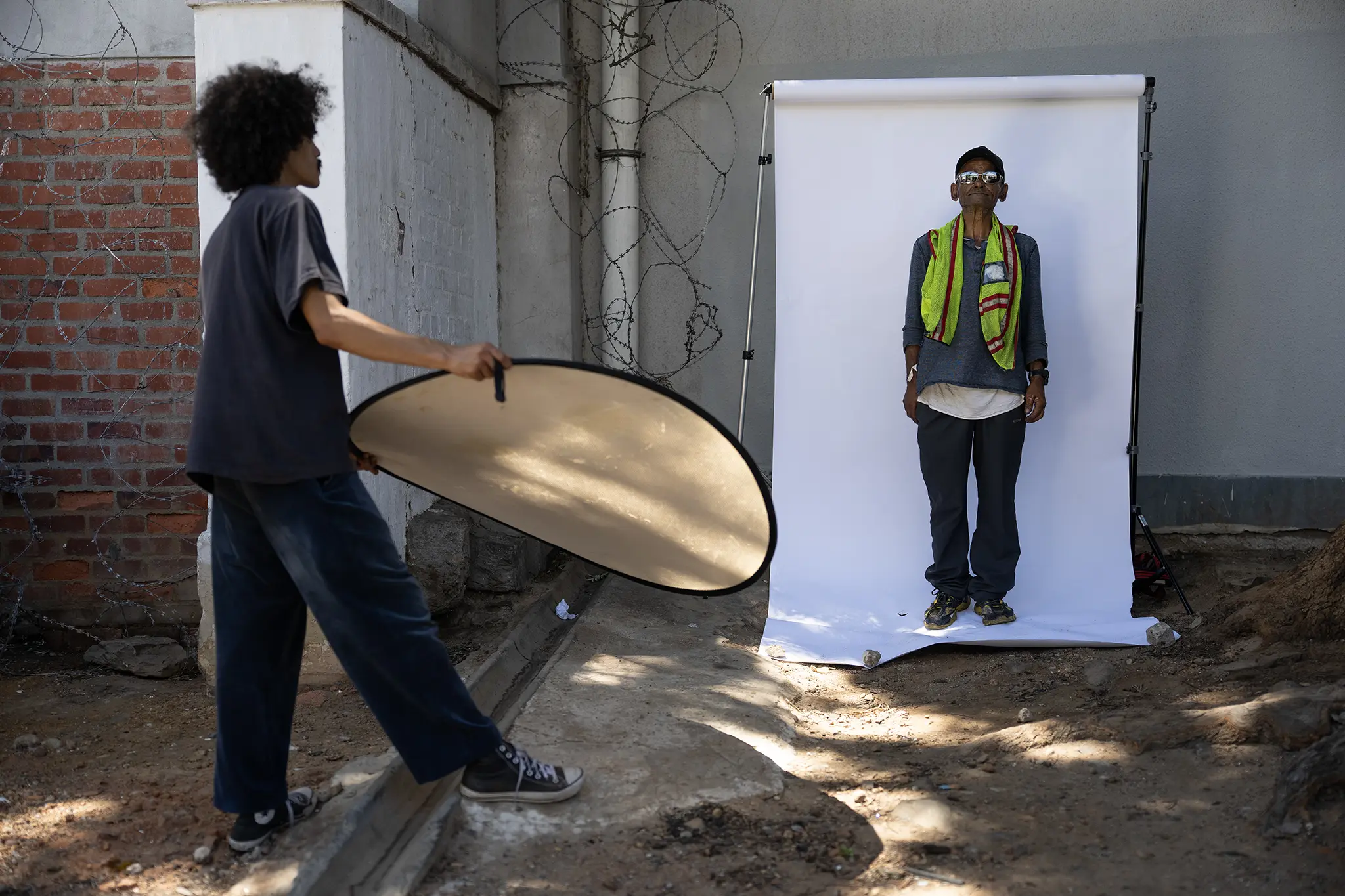 Behind-the-scenes: Jeremy Williams being photographed in an outdoor portrait studio
