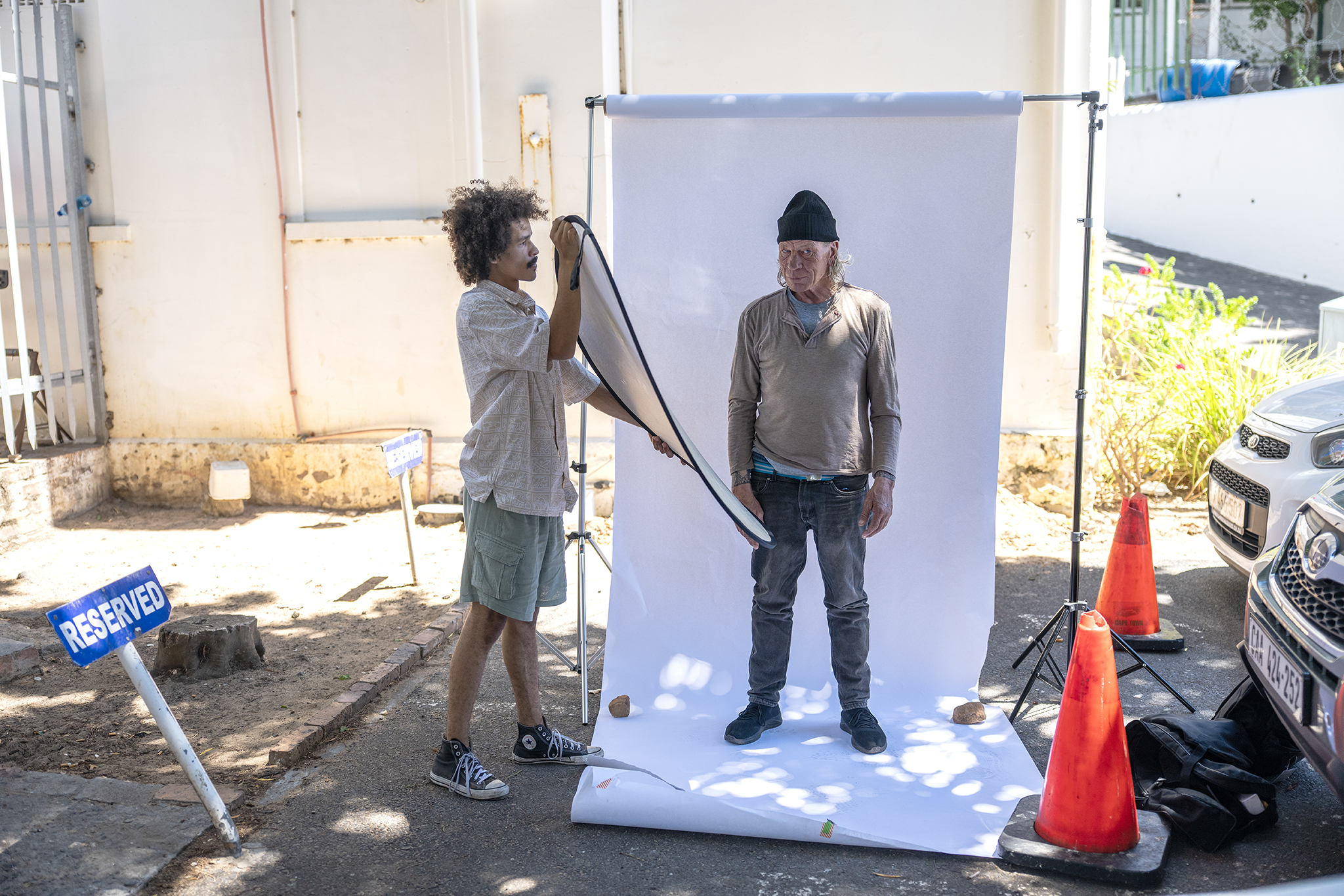 Behind-the-scenes: Martin Decker being photographed in an outdoor portrait studio