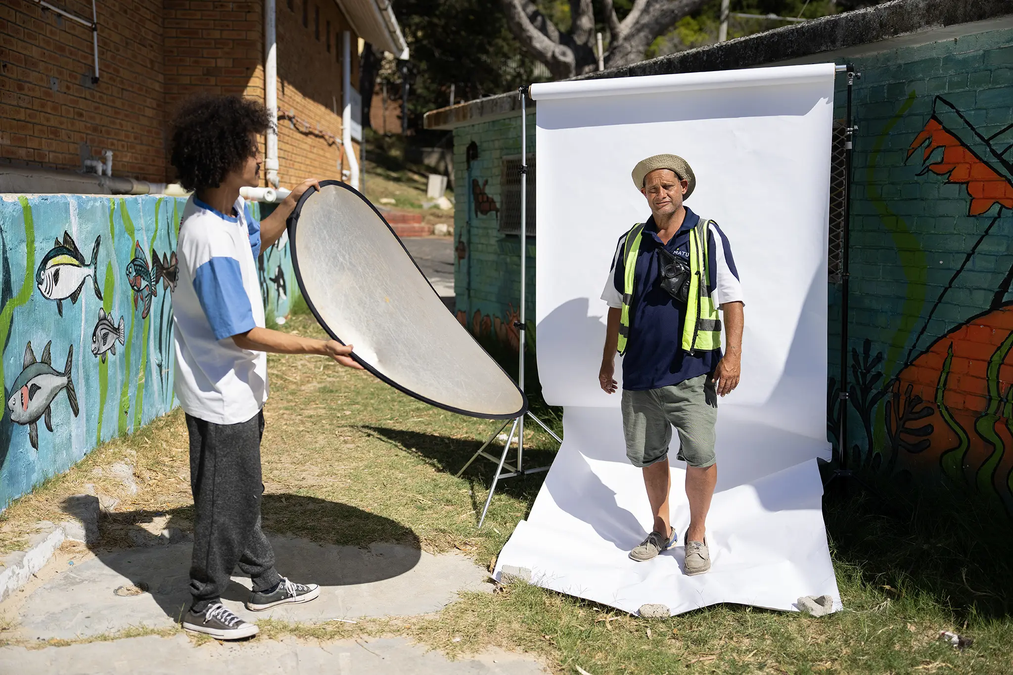 Behind-the-scenes: Quentin Oberholster being photographed in an outdoor portrait studio